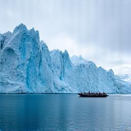 Glacier with a zodiac boat in Svalbard